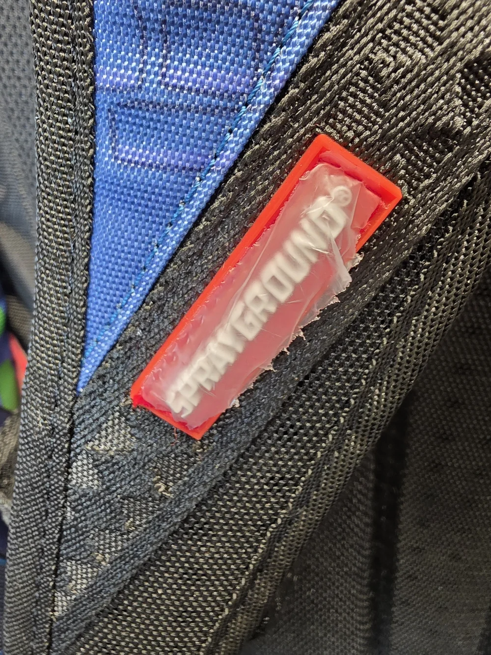 Sprayground DC Joker No Rules Backpack featuring a vibrant, graffiti-styled Bag